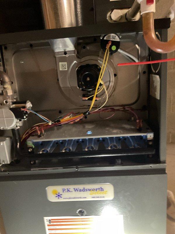 Performed routine heating maintenance service on residential system. Inspected blower wheel assembly for proper operation and cleaned components. Examined internal furnace components including motor assembly, electrical connections, and copper tubing for optimal functionality.