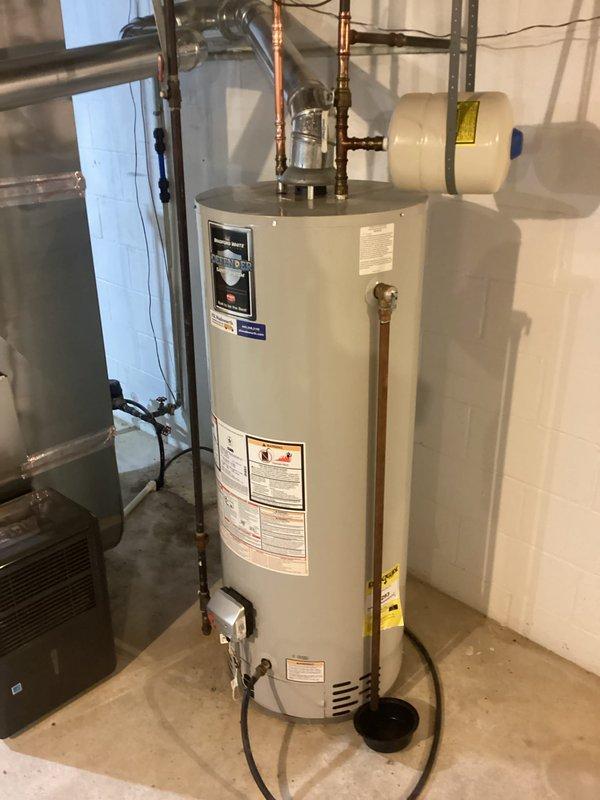 Performed courtesy inspection of residential water heater to assess anode rod replacement needs. Evaluated expansion tank and overall system installation including copper lines, pressure relief valve, and all connections. System appears to be in good working condition with no visible leaks or deterioration.