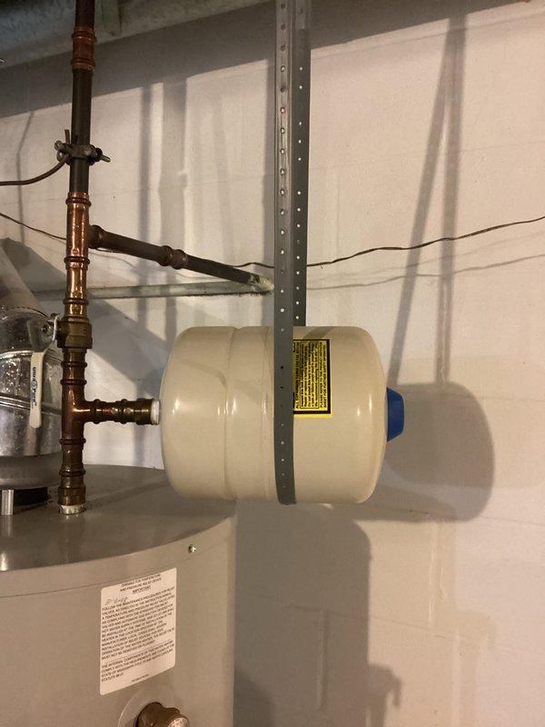 Performed courtesy inspection of residential water heater to assess anode rod replacement needs. Evaluated expansion tank and overall system installation including copper lines, pressure relief valve, and all connections. System appears to be in good working condition with no visible leaks or deterioration.