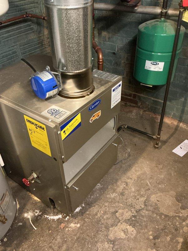 Performed comprehensive maintenance service on 10-year-old Carrier gas boiler installed in customer's basement. Inspected all components including expansion tank and copper piping connections. Used specialized tools to clean and service the unit, ensuring proper operation for the heating season. No critical issues identified during inspection.