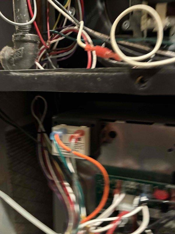 Performed scheduled maintenance on heating system 1. Inspected electrical components including control board, motor assembly, and wiring connections. Verified proper function of fan motor and electrical relay system with all connections secure and operational.