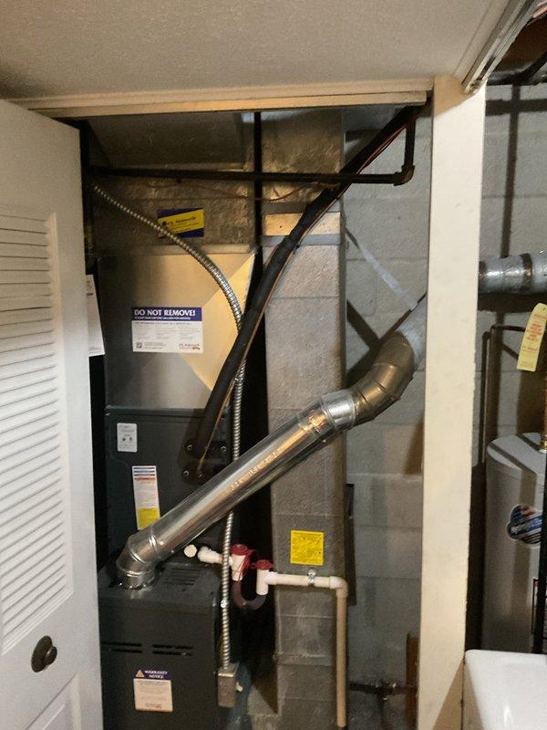 Performed routine heating maintenance on residential furnace system. Inspected blower assembly, electrical connections, and exhaust components. All systems functioning properly with no issues identified.
