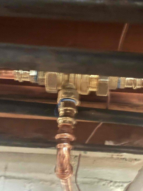 Responded to customer complaint of low pressure error message on Rinnai boiler system. Diagnostic inspection revealed system pressure had dropped to 16 PSI as displayed on the control panel. Recharged the system through the manifold fill valve to restore proper operating pressure and verified normal operation with no error messages.