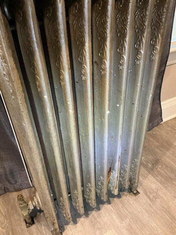 Conducted comprehensive diagnostic assessment on boiler system following reported eruption through vents. Inspected decorative cast iron radiator and associated ductwork, taking measurements to evaluate system integrity. Findings have been documented with photographic evidence to assist client's insurance claim and determine optimal repair versus replacement options.