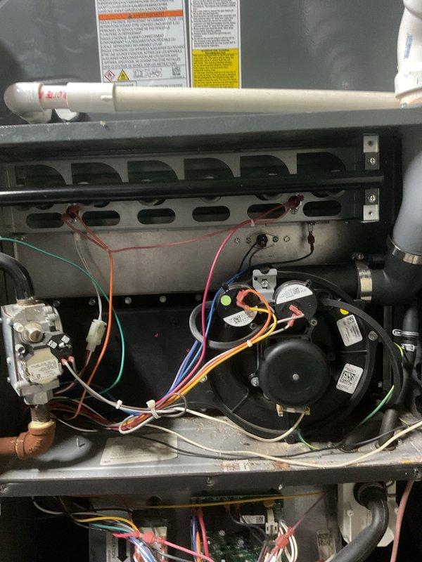 Performed routine heating maintenance on residential furnace system. Inspected blower motor, electrical connections, PVC ventilation components, and Airboss zone control system. All components found to be functioning normally with no issues requiring correction.
