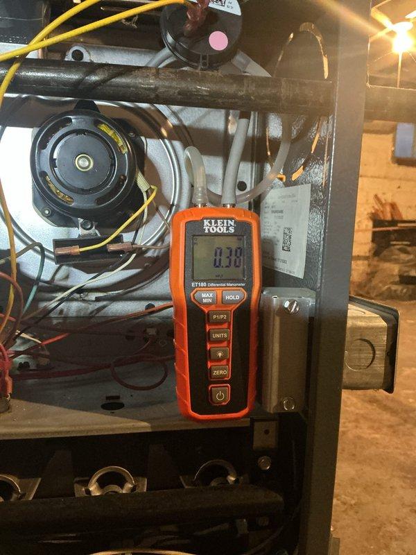 Responded to no heat call where system was cycling and blowing cold air. Diagnosed faulty pressure switch as evidenced by 0.38 reading on differential thermometer. Replaced defective pressure switch to restore proper system operation and heating functionality.