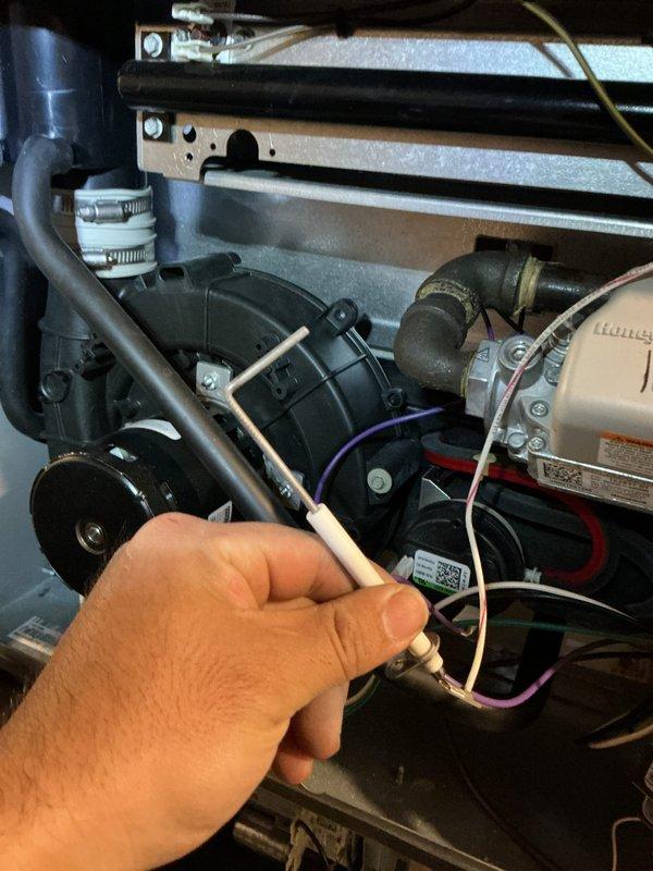 Performed routine maintenance on aging Goodman heating system. Accessed internal components to inspect electrical connections and tested blower motor operation. System is functioning adequately despite age, with all components cleaned and verified operational.