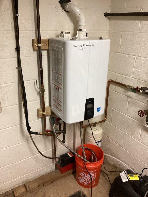 Performed scheduled monthly tankless water heater flush service on a wall-mounted Rheem unit. Successfully flushed sediment from system using appropriate equipment and verified proper operation of all valves and connections. Refilled system and confirmed normal operation with no leaks detected in the copper supply lines or at connection points.