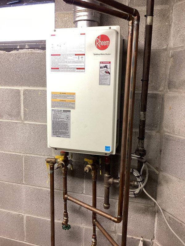 Performed scheduled monthly tankless water heater flush service on a wall-mounted Rheem unit. Successfully flushed sediment from system using appropriate equipment and verified proper operation of all valves and connections. Refilled system and confirmed normal operation with no leaks detected in the copper supply lines or at connection points.
