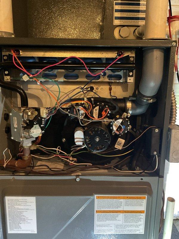 Performed routine heating maintenance service on unit. Inspected interior components including blower assembly and electrical connections. Visual examination of squirrel cage fan revealed proper installation with no visible debris or damage.