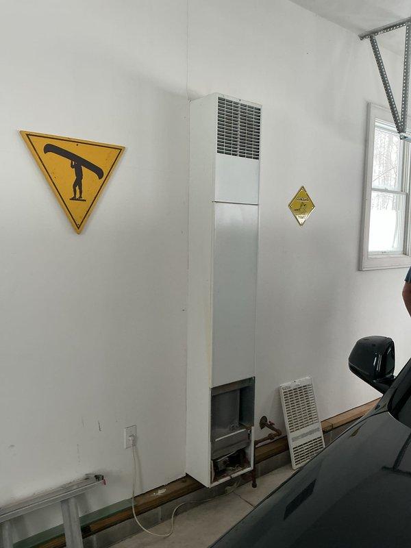 Responded to service call for wall-mounted garage furnace with pilot light ignition failure. Upon inspection of the unit, accessed internal components through the bottom panel and successfully relit the pilot light, restoring proper furnace operation.