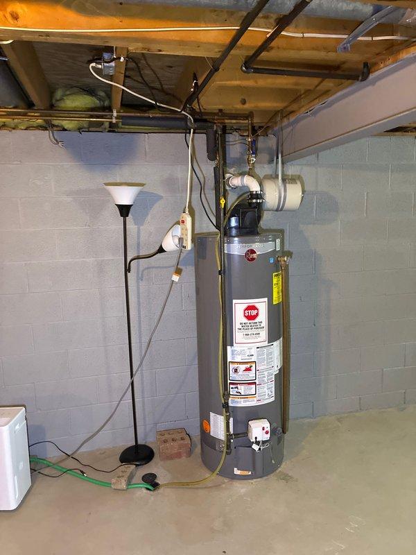 Completed comprehensive assessment of existing HVAC system and water heater in basement location. Evaluated furnace replacement options and presented customer with both standalone furnace solutions and complete system replacement alternatives. Documented current installation configuration, including PVC drainage system, ductwork condition, and existing mechanical room layout for proper equipment sizing and installation planning.