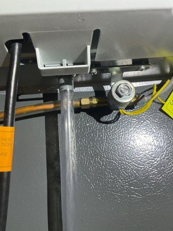 Responded to customer-reported water leak from furnace. Upon inspection, identified a leak from the Aprilaire humidifier mounted on the furnace unit. Tightened loose connection on the humidifier's water supply line and verified proper drainage through the PVC pipe system. Tested system operation to confirm leak was resolved.