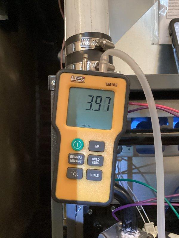 Performed comprehensive heating tune-up service including combustion efficiency testing with Testo 310 analyzer (99.6% efficiency recorded) and static pressure measurement using UEi EM152 device (3.97" WC). System operating within manufacturer specifications with all connections verified and electrical components inspected.