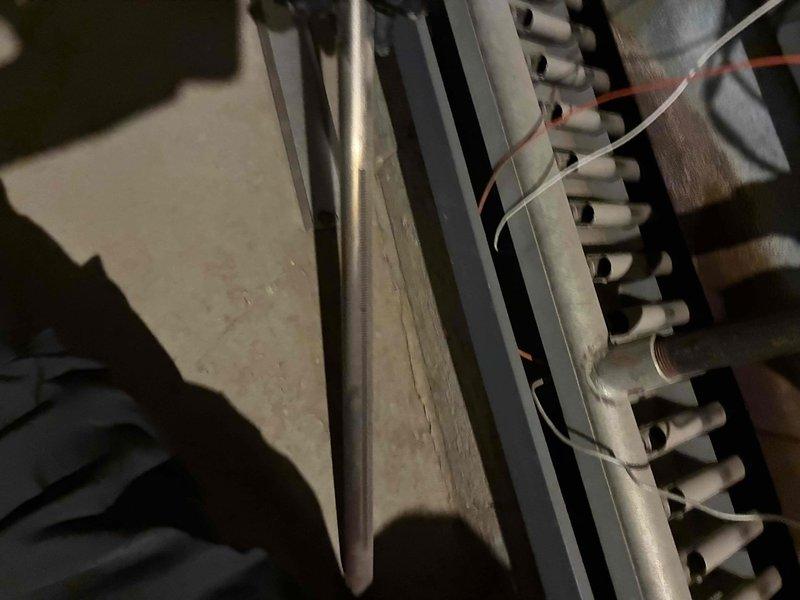 Performed routine heating maintenance service on boiler system. Inspected heat exchanger fins and associated plumbing connections. All components verified to be in functional condition with no issues detected.