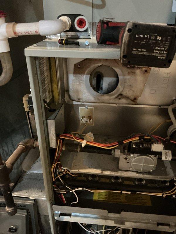 Completed repair work on the heating system by installing a new inducer motor and repairing the flue pipe connection. Inspection confirmed proper venting and system operation after repairs were completed.