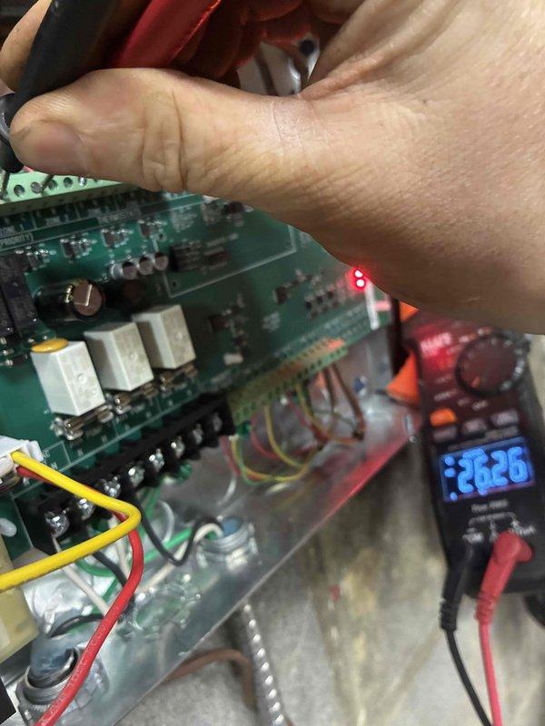 Diagnosed no-heat complaint by testing control board voltage, finding 26.26V at circuit board and 22.17V AC at secondary terminals. Determined failing transformer was causing insufficient voltage to energize heating components. Replaced transformer, verified proper voltage output, and confirmed system operation through complete heating cycle.