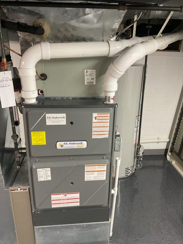 Performed routine heating maintenance on P.E. Wadsworth furnace system. Inspected PVC ventilation pipes, electrical connections, and adjacent ductwork. System functioning properly with no issues identified.