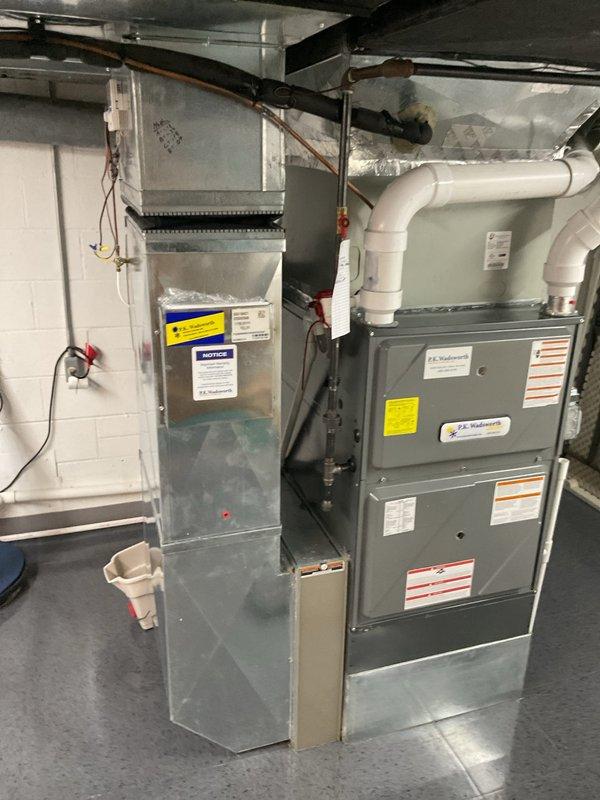Performed routine heating maintenance on P.E. Wadsworth furnace system. Inspected PVC ventilation pipes, electrical connections, and adjacent ductwork. System functioning properly with no issues identified.