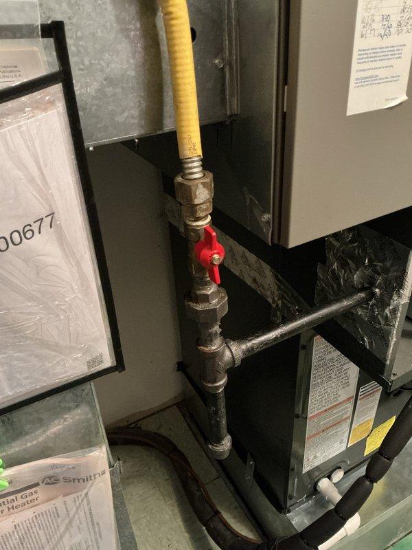 Performed scheduled monthly heating maintenance service on HVAC system. Inspected air filter (Dynamic brand) and verified proper installation with safety switch connection intact. Examined gas line assembly with shut-off valve and insulated piping, confirming all components are in good working condition with no issues detected.