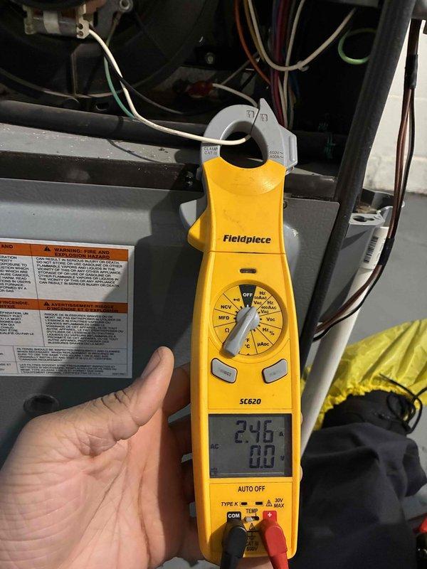 Performed scheduled maintenance on heating system. Conducted electrical testing with clamp meter, measuring 246V at components. Inspected blower wheel assembly which was found to be clean and operating normally with no signs of debris or wear.