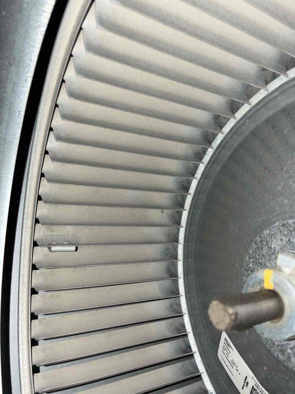 Performed scheduled maintenance on heating system. Conducted electrical testing with clamp meter, measuring 246V at components. Inspected blower wheel assembly which was found to be clean and operating normally with no signs of debris or wear.