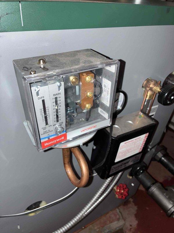 Successfully completed installation of a new Peerless boiler system in basement mechanical room. Installed all necessary plumbing connections including PVC piping network and properly mounted the Honeywell Vaporstat pressure control device. System was tested and verified operational with all controls properly calibrated.