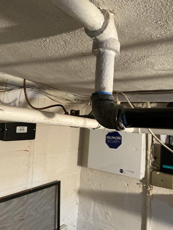 Completed replacement of two Hofman units and performed a 3-foot pipe repair in basement utility area. Installed new PVC piping with proper 90-degree connections to existing black pipe fittings, secured with appropriate sealant. Addressed damaged sections showing gaps and deterioration at connection points, restoring system integrity and functionality.