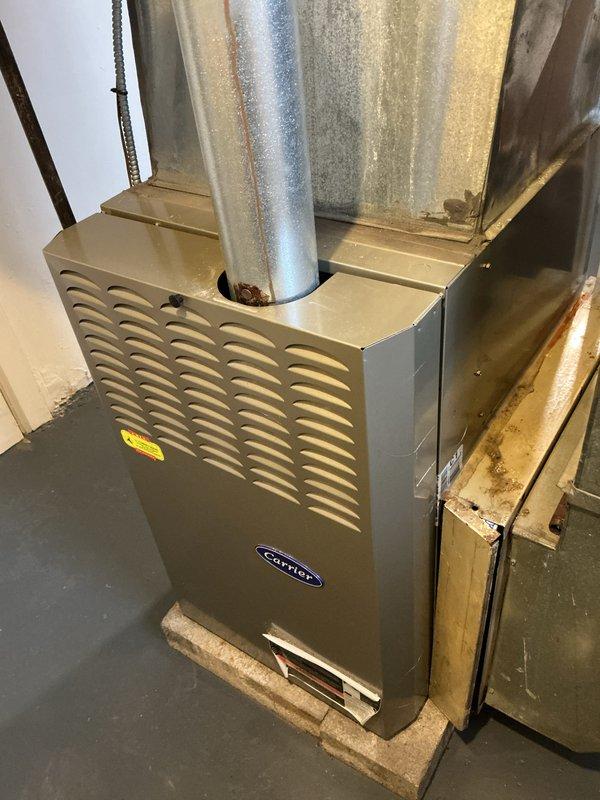 Performed scheduled monthly heating maintenance service on Carrier furnace. Inspected blower motor assembly, fan components, and gas valve for proper operation. Visual examination of furnace housing, ductwork connections, and exhaust system confirmed unit is functioning within normal parameters with no significant issues detected.