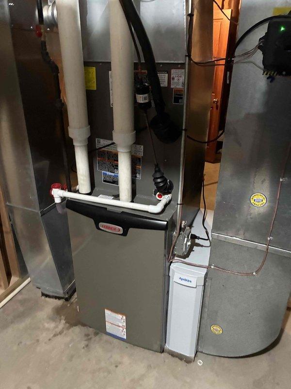 Responded to customer complaint of no heat in one room. Diagnosed and removed faulty blower motor assembly from Lennox furnace system. Installed new motor component to restore proper airflow distribution throughout the home's heating system.