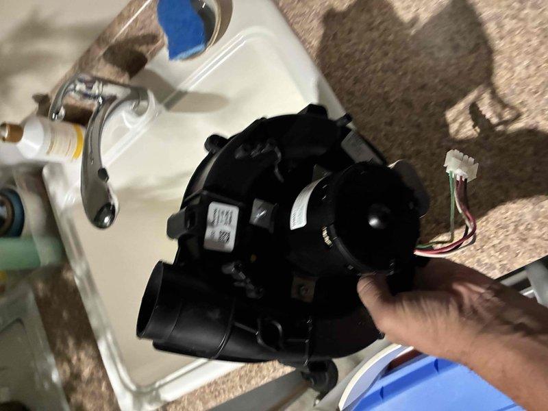 Responded to customer complaint of no heat in one room. Diagnosed and removed faulty blower motor assembly from Lennox furnace system. Installed new motor component to restore proper airflow distribution throughout the home's heating system.