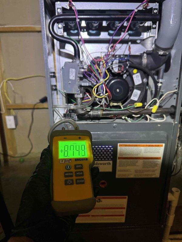 Responded to no heat complaint at residence following previous service call. Performed diagnostic testing with manometer on Goldsworth furnace system, obtaining pressure reading of 0.749. Inspected internal components including wiring, fan assembly, and control board. Serviced unit to restore proper heating function.