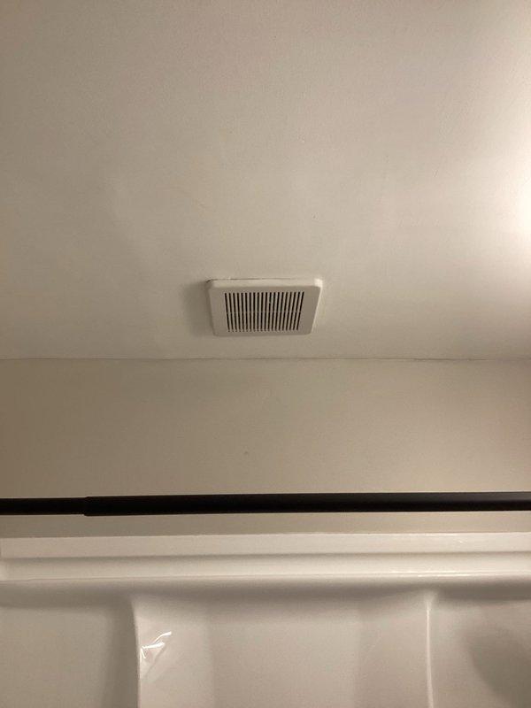 Diagnosed and repaired water leak from bathroom exhaust fan vent. Inspection revealed moisture intrusion through the ceiling-mounted ventilation unit above the shower/tub enclosure. Successfully stopped water leakage and restored proper functionality of the exhaust system.