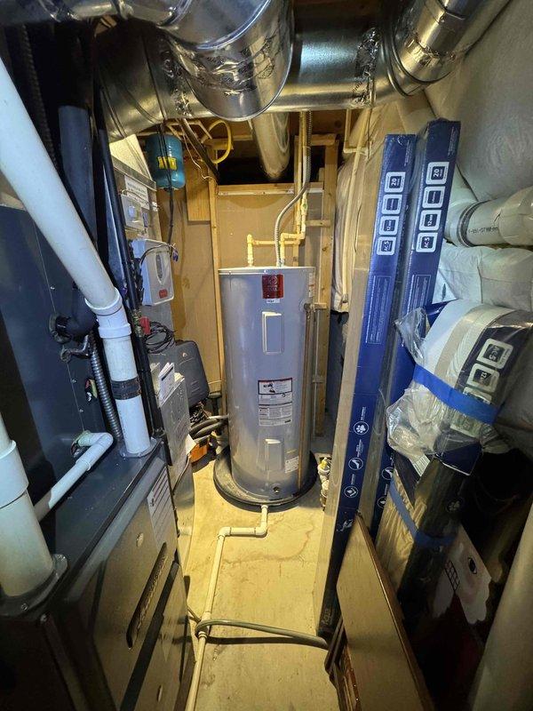 Performed seasonal heating tune-up on residential HVAC system located in basement utility room. Inspection revealed severely clogged air filter with significant dust accumulation that was restricting proper airflow. Replaced filter and verified proper system operation to restore optimal heating performance and efficiency.