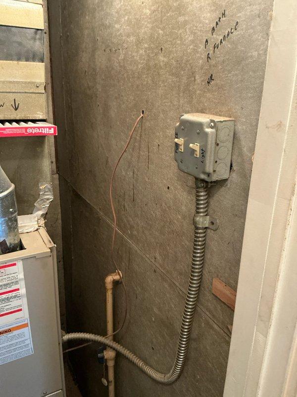 Conducted comprehensive evaluation of existing furnace system for potential replacement options. Inspected galvanized ductwork connections, junction points, and electrical components including junction box and associated wiring. Documented current installation configuration to develop appropriate replacement recommendations.