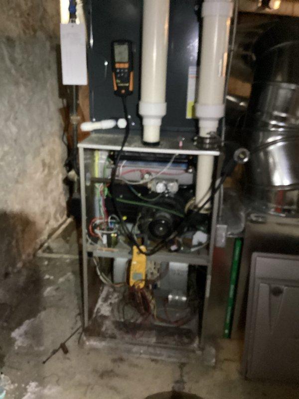 Performed comprehensive furnace maintenance including electrical system diagnostics. Inspected internal components and verified proper operation of all control systems. Electrical measurements showed normal amperage readings of 0.047 and 0.043, confirming system is operating within manufacturer specifications.