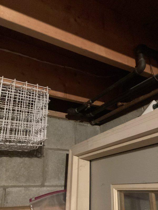 Completed inspection of existing gas line configuration in basement utility room and evaluated requirements for extending service to garage heater. Examined current meter location and piping path through basement joists. Assessed garage wall-mounted heating unit to determine appropriate connection points and BTU requirements for proper gas line sizing.