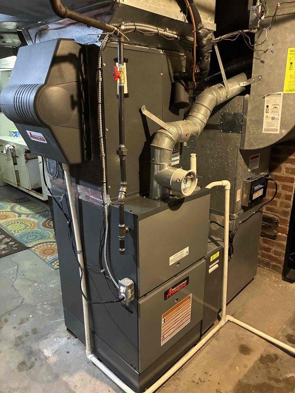 Successfully installed an 80% efficiency furnace system with complete ductwork integration. Installed unit features proper metal tape sealing on connections and includes all necessary electrical and gas hookups. System was thoroughly tested and is functioning as designed.