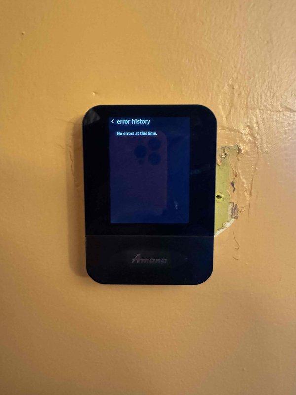 Responded to no heat complaint on a system previously serviced. Accessed Amana control board to check error history, which displayed "No errors at this time." Performed electrical testing with multimeter on system components, confirming proper voltage readings. Restored heat operation after diagnosing and correcting a loose wire connection at the control board.