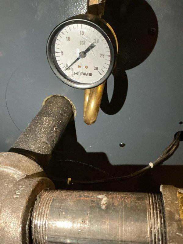 Responded to emergency no-heat call for radiant boiler system installed less than 5 years ago. Diagnostic inspection revealed low water level in system as indicated by VAT Programmable Water Feeder control unit. Adjusted system pressure from 17 PSI to appropriate operating range and reset controller, restoring normal heat function.