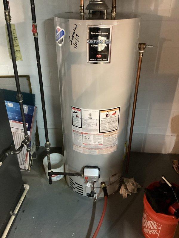 Installed new 3/4" ball valve and performed water heater maintenance on Bradford White Defender unit. Inspected all plumbing connections, checked pressure relief valve, and verified proper operation of the water meter assembly. All systems functioning correctly with no leaks detected.