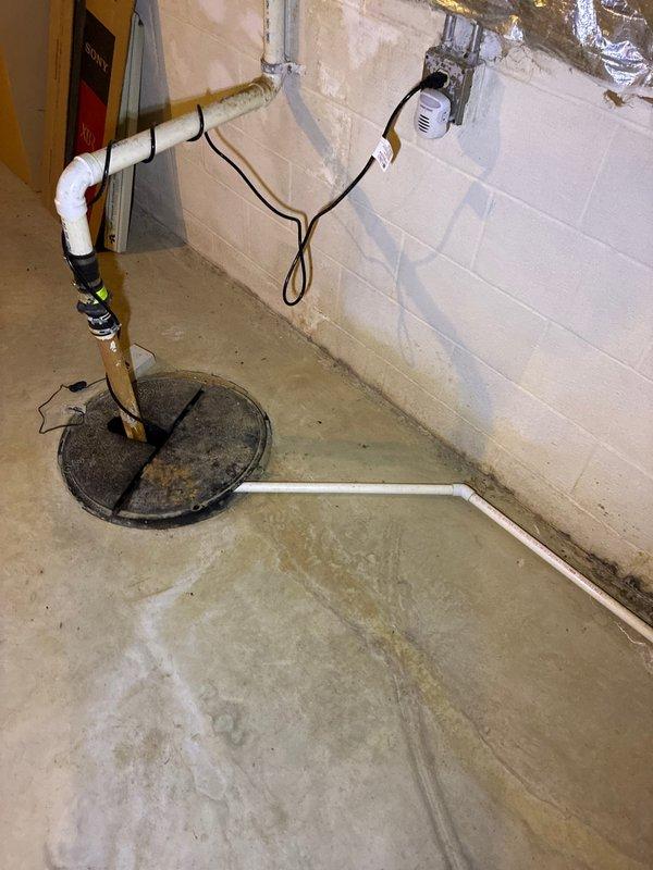 Conducted comprehensive inspection of basement utility area for furnace replacement options. Evaluated existing HVAC infrastructure including sump pump system and associated plumbing. Documented current insulation conditions, noting damaged foil-faced insulation and copper piping configuration for replacement planning considerations.