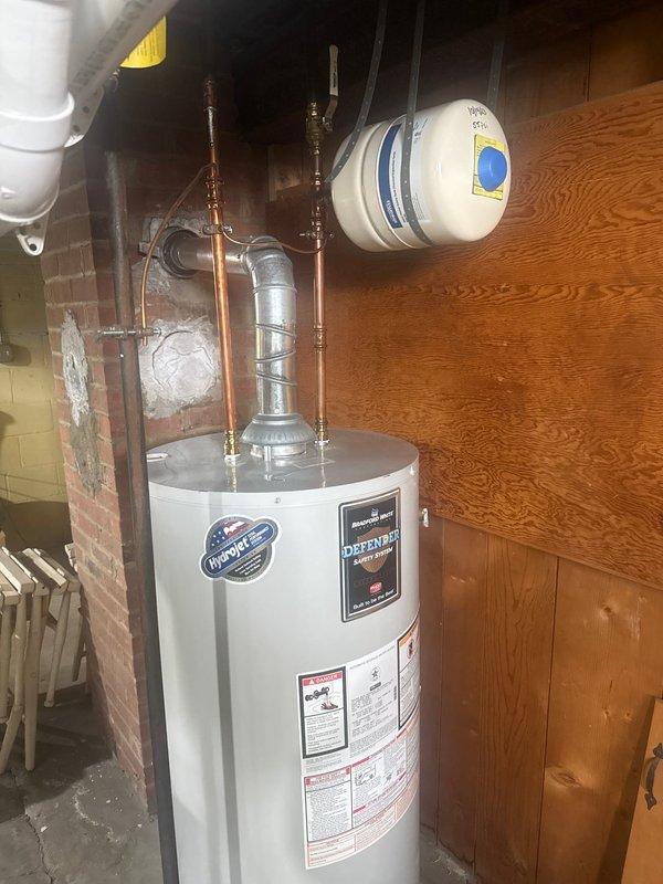 Performed routine maintenance on Bradford White water heater with Defender Safety System. Inspected expansion tank, copper supply lines, vent pipe, and all connections. System was found to be in proper operating condition with no leaks or corrosion detected.