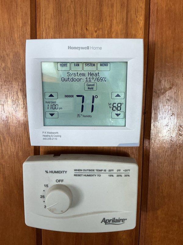 Responded to service call for furnace not keeping up with thermostat setpoint. Inspected system and found thermostat was functioning properly, showing correct indoor temperature of 71° with 35% humidity. Checked humidistat settings and adjusted from near-OFF position to appropriate seasonal setting. Unit now maintaining desired temperature.