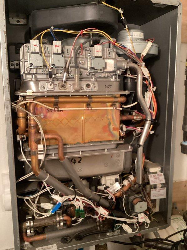Responded to service call for tankless water heater displaying code 10. Performed diagnostic inspection of internal components, including heat exchanger, gas valve assembly, and electrical connections. Examined venting system and gas supply components to resolve the error code issue.
