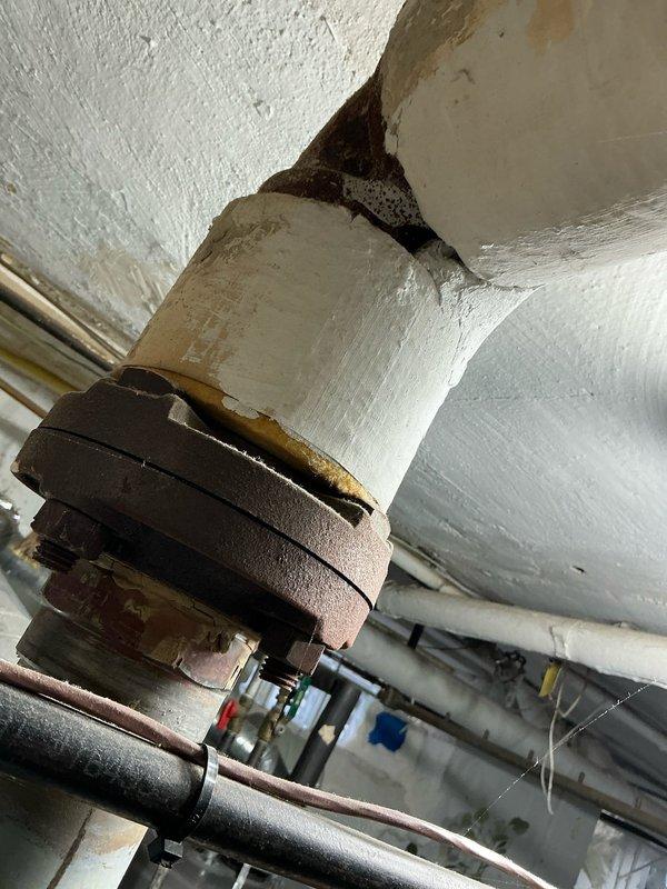 Inspected 23-year-old Weil-McLain EG/PEG-50 boiler (145k BTU/hr) with recurring pilot light issues requiring constant resetting. Observed significant corrosion at pipe connections, deteriorated insulation, and water damage at ceiling junction. Documented condition of Honeywell control system, pressure gauge, and associated valves for comprehensive replacement quote.