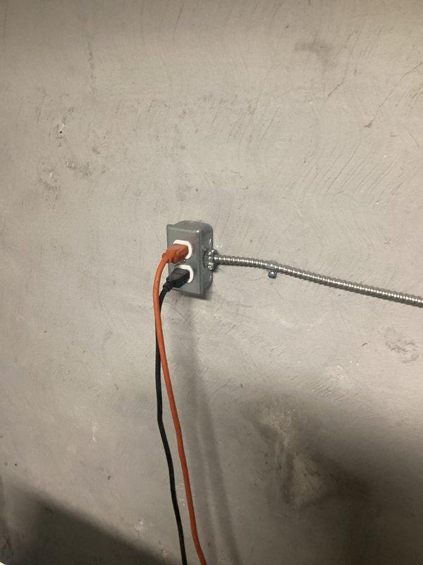 Performed complimentary electrical inspection of customer's panel box. Examined junction box connections, noting the condition of armored cable and wire terminations. Inspected main breaker panel, evaluating circuit breakers, wire connections, and labeling. All systems were documented with photographs for reference.