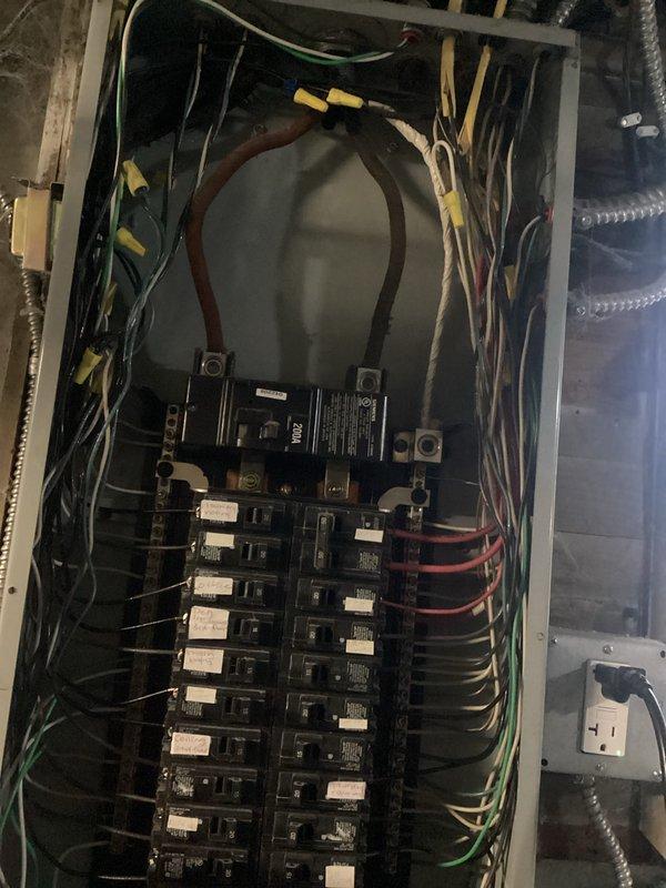 Performed complimentary electrical inspection of customer's panel box. Examined junction box connections, noting the condition of armored cable and wire terminations. Inspected main breaker panel, evaluating circuit breakers, wire connections, and labeling. All systems were documented with photographs for reference.