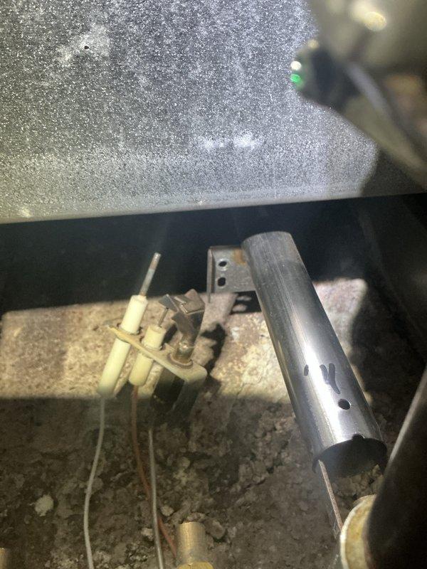 Performed annual maintenance on 12+ year old boiler system. Found significant dust/frost accumulation on heat exchanger and ignition assembly. Cleaned components, checked electrical connections, and verified proper operation of safety controls. Recommended continued annual maintenance due to equipment age.