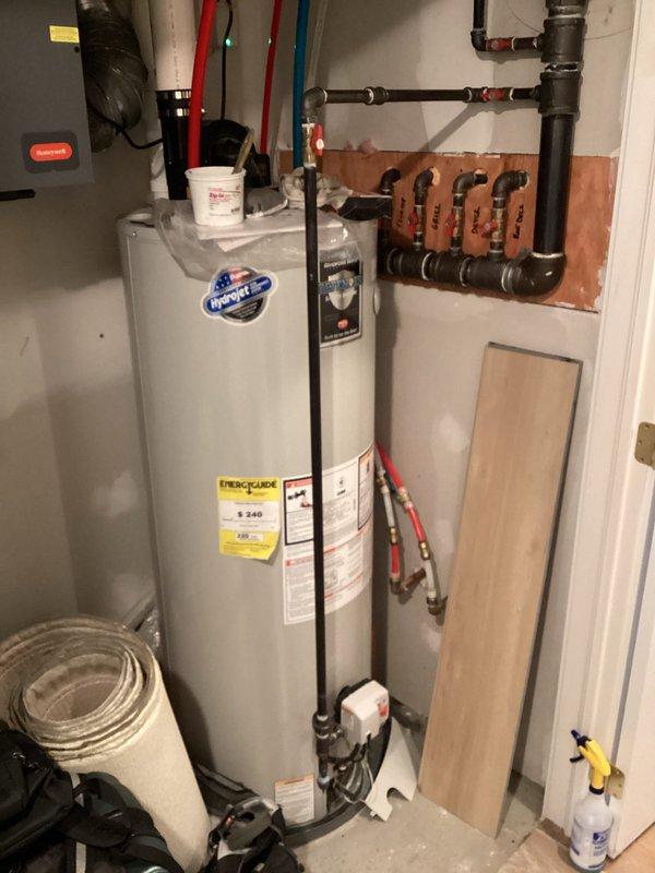 Responded to error code indicating gas leak on tanked water heater. Performed leak detection test using soap solution on pipe joints, confirming previous repair by gas company had resolved the main leak. Reset error code and verified proper heater operation.